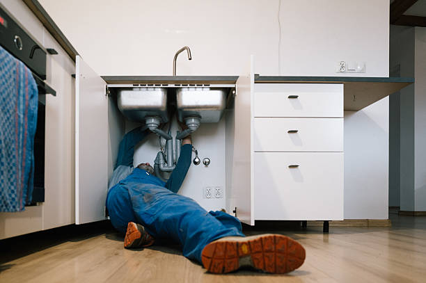 Professional Plumbing technician working in Holtsville, NY
